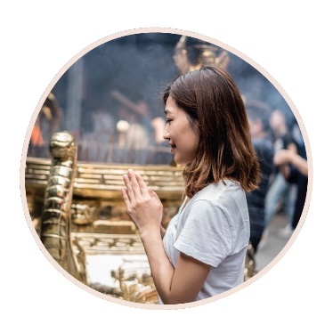 A person practising their religion.